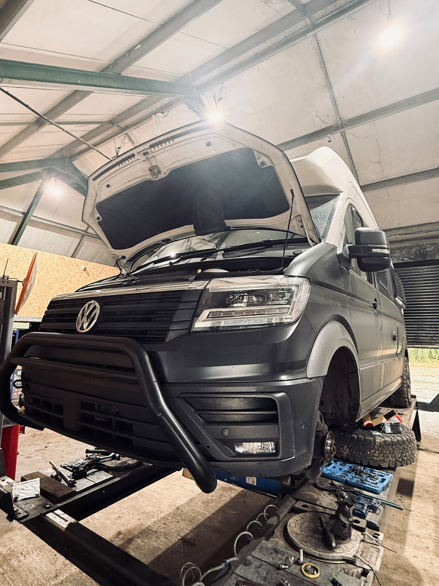 VW Grand California TDI in workshop during brake repair
