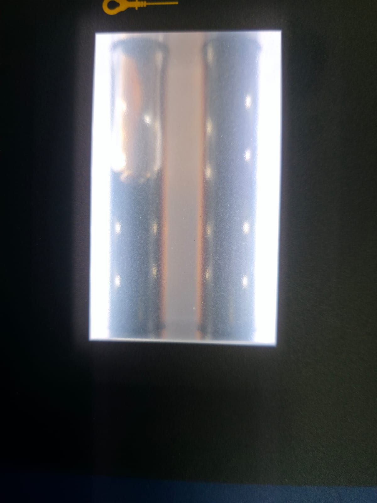 Used gearbox oil visible through service machine line